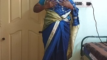A Lustful Indian Wife From The South, Draped In A Blue Saree, Flaunts Her Ample Bosom And Smooth Pussy While Teasing Her Hard Nipples And Rubbing Herself To Ecstasy.